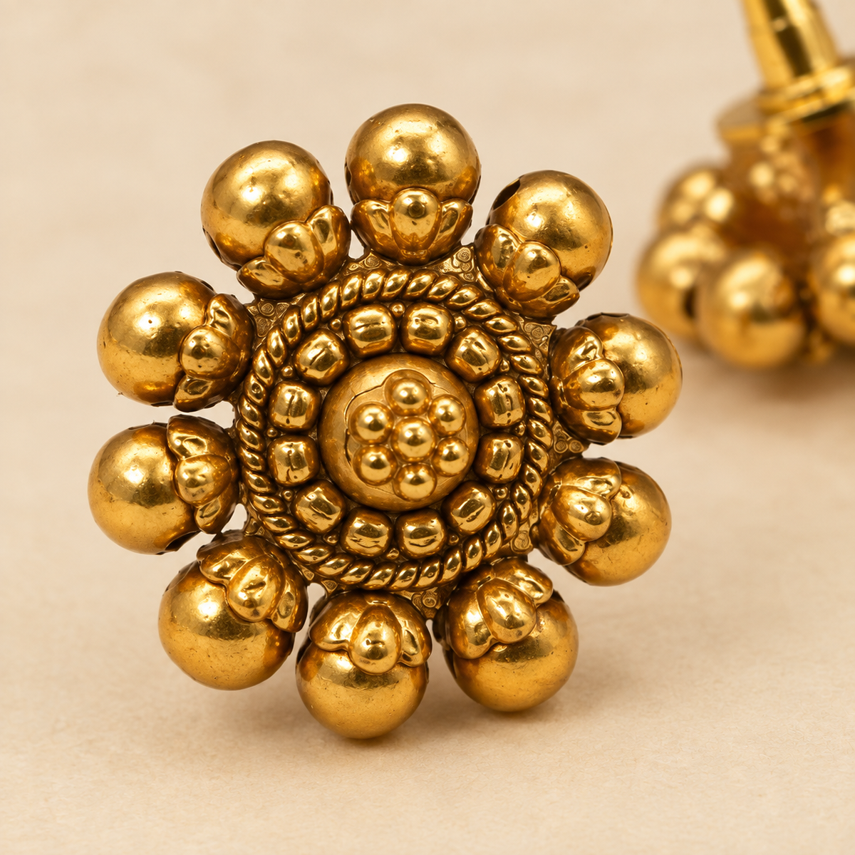 Model wearing antique gold flower stud earrings